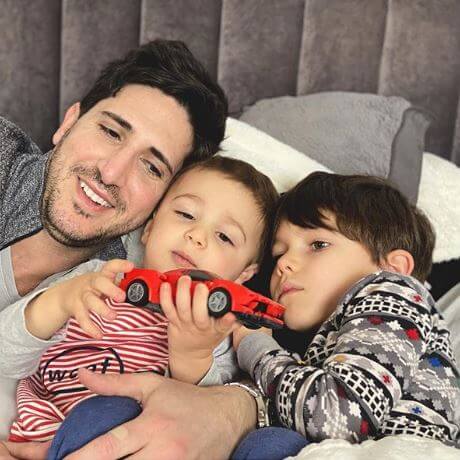 Andrea DeVos's husband, Michael Abraham, with their sons.